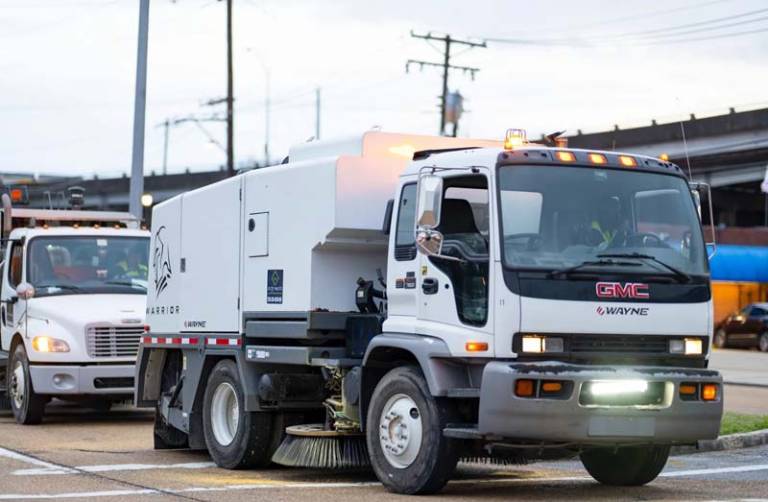Street sweeper on road