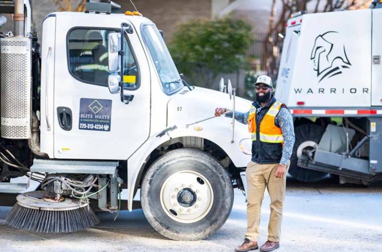 Worker next to truck